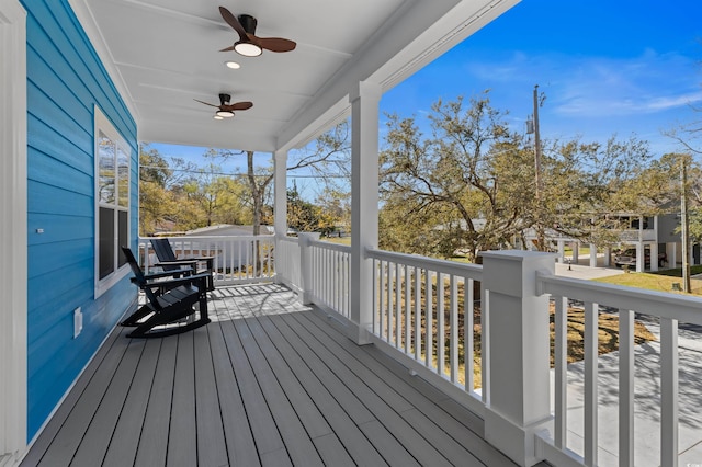 wooden deck featuring ceiling fan