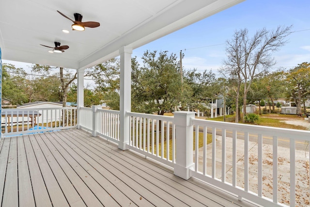 wooden terrace featuring a ceiling fan