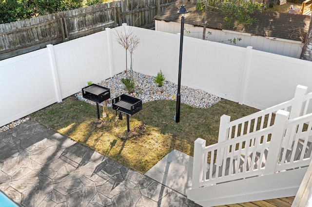 view of yard with a fenced backyard