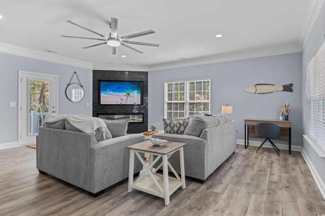 kitchen featuring stainless steel appliances, kitchen peninsula, pendant lighting, light hardwood / wood-style floors, and white cabinets