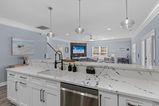 kitchen with a sink, stainless steel dishwasher, open floor plan, visible vents, and ornamental molding