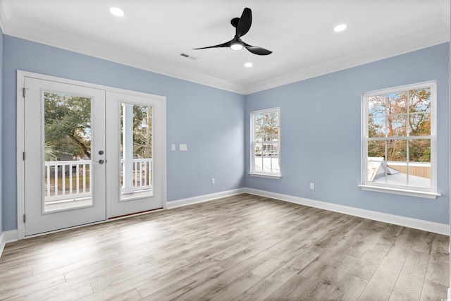 unfurnished room featuring crown molding, french doors, ceiling fan, and light wood-type flooring