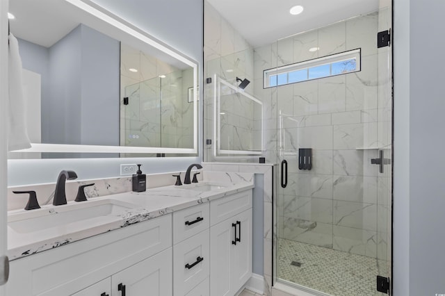 full bathroom featuring double vanity, a sink, recessed lighting, and a shower stall