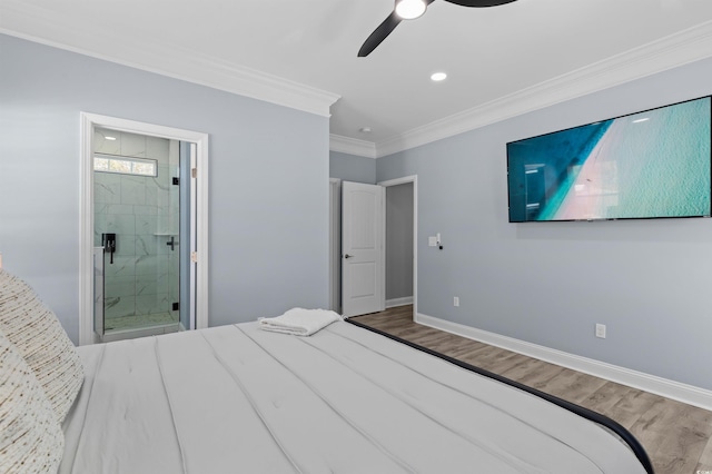unfurnished bedroom with crown molding, a ceiling fan, wood finished floors, ensuite bathroom, and baseboards