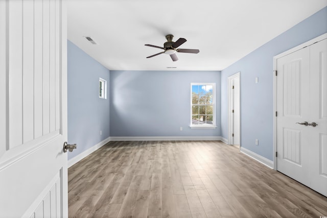 unfurnished bedroom featuring light hardwood / wood-style flooring and ceiling fan