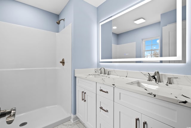 bathroom featuring vanity and walk in shower