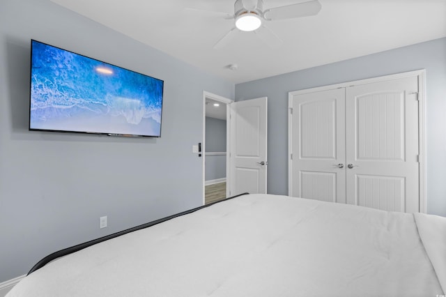 unfurnished bedroom with a closet and ceiling fan
