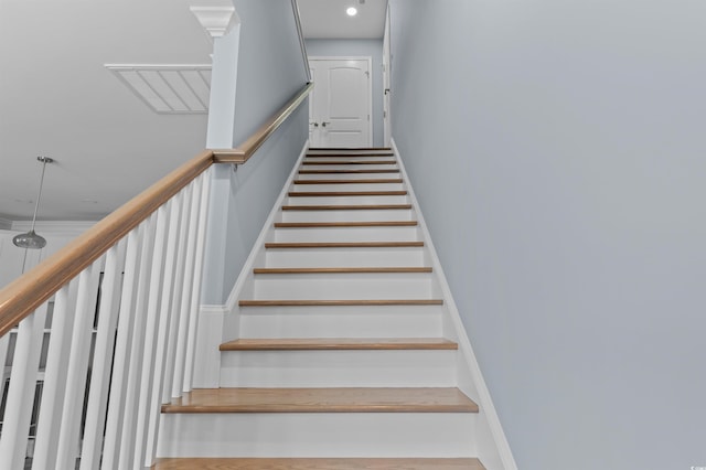 stairs featuring baseboards and recessed lighting