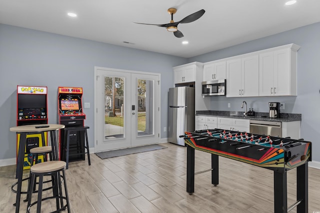 rec room with recessed lighting, french doors, baseboards, a sink, and ceiling fan