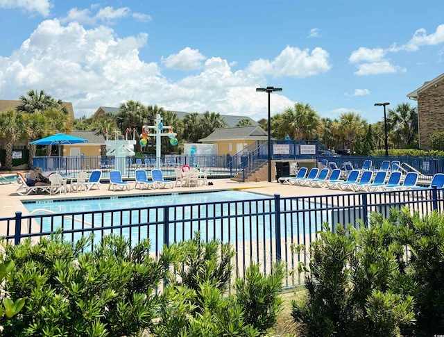 view of swimming pool with a patio area