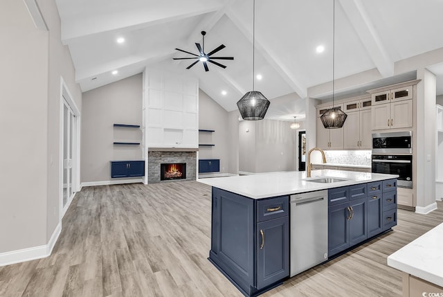 kitchen with white cabinetry, ceiling fan, sink, pendant lighting, and appliances with stainless steel finishes