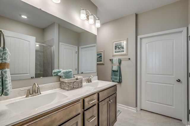 bathroom featuring dual vanity and tile flooring