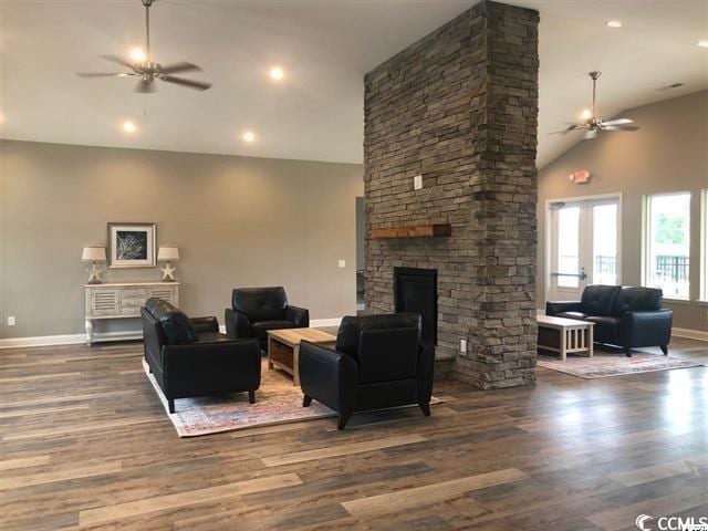 living room with high vaulted ceiling, ceiling fan, dark hardwood / wood-style floors, and a fireplace