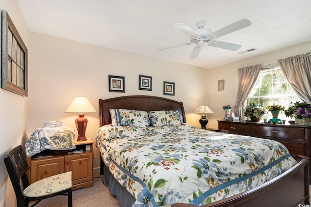 bedroom featuring light carpet and ceiling fan