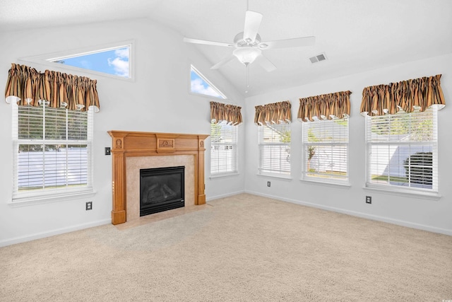unfurnished living room featuring lofted ceiling, carpet, a fireplace, a ceiling fan, and baseboards