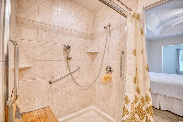 bathroom featuring a textured ceiling and walk in shower