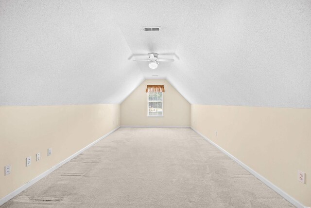 2513 Hunters Trl, Myrtle Beach, SC 29588 - additional living space with a textured ceiling, carpet flooring, lofted ceiling, ceiling fan, and baseboards