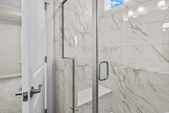 bathroom featuring a shower with door