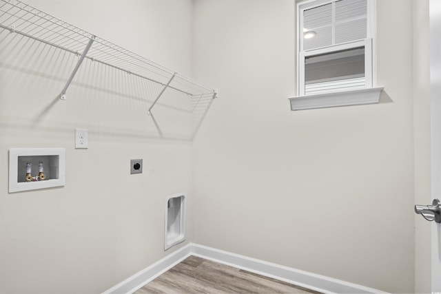 laundry area with hookup for an electric dryer, wood-type flooring, and hookup for a washing machine