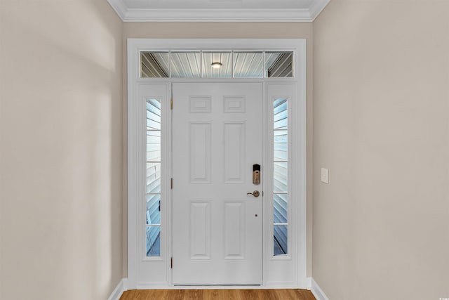 foyer entrance featuring light hardwood / wood-style floors and ornamental molding