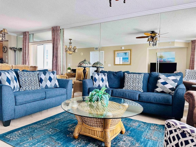 carpeted living room with ceiling fan with notable chandelier, a textured ceiling, and ornamental molding