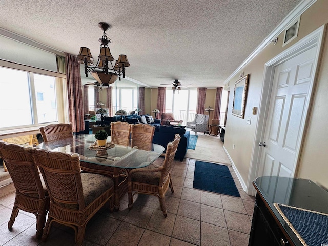 dining room featuring tile flooring, a textured ceiling, and crown molding