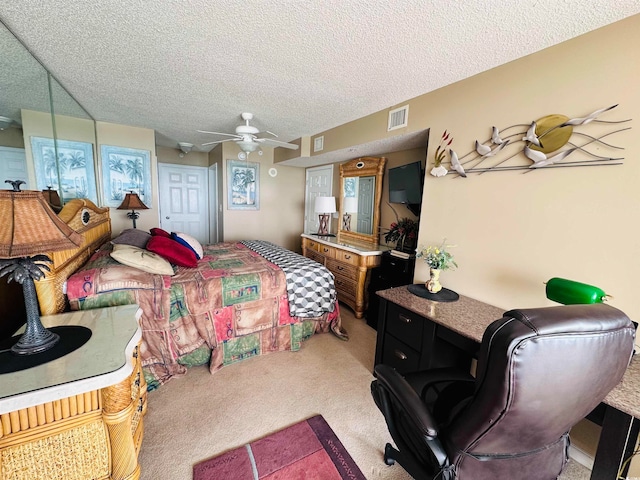 bedroom with carpet, ceiling fan, and a textured ceiling