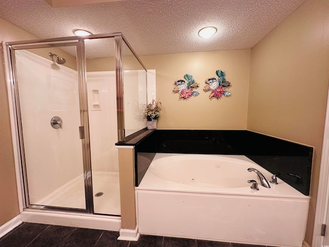 bathroom with tile floors, a textured ceiling, and plus walk in shower