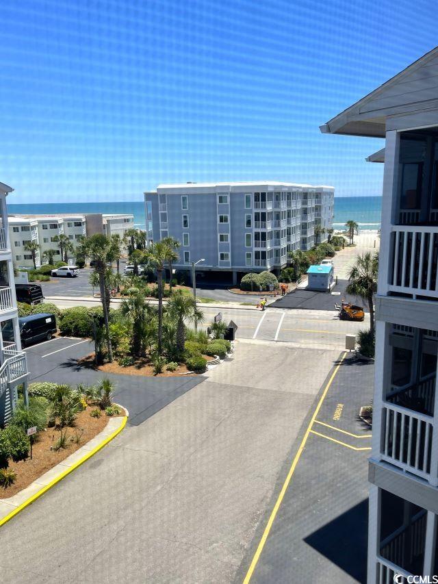 view of building exterior featuring a water view