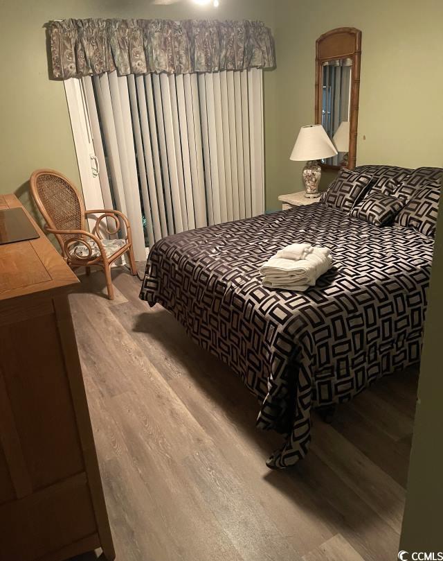 bedroom featuring hardwood / wood-style flooring