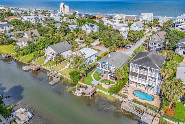 drone / aerial view with a water view