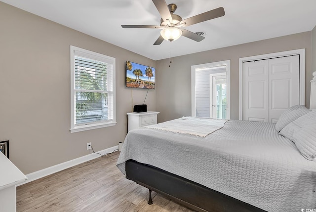 bedroom with ceiling fan, a closet, and light hardwood / wood-style flooring