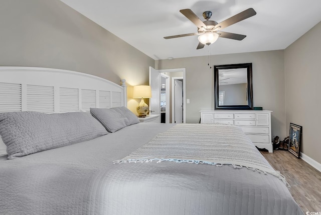 bedroom with ceiling fan and light hardwood / wood-style flooring