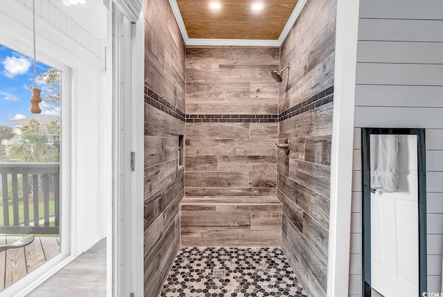 bathroom with a tile shower