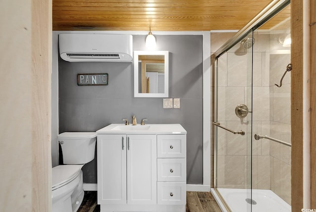 bathroom featuring toilet, wood ceiling, a shower with door, a wall unit AC, and vanity