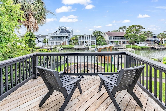 wooden terrace with a dock and a water view