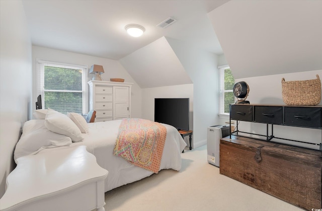 bedroom featuring lofted ceiling and carpet flooring