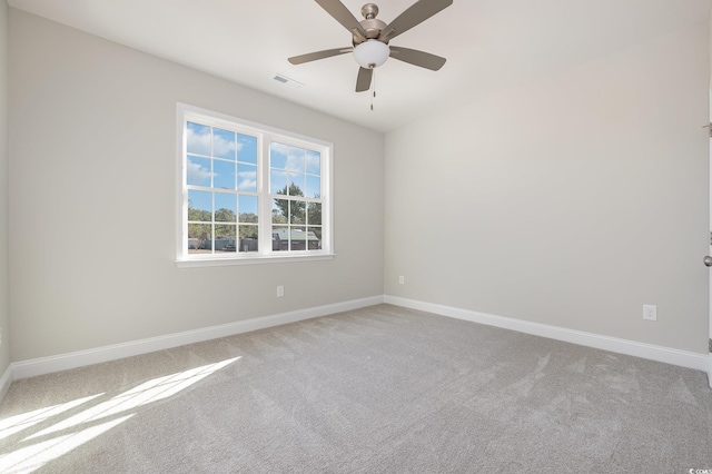 empty room featuring carpet and ceiling fan