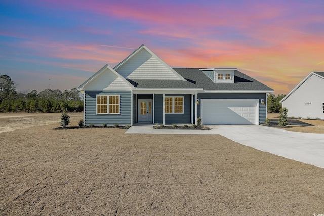 view of front of property with a garage