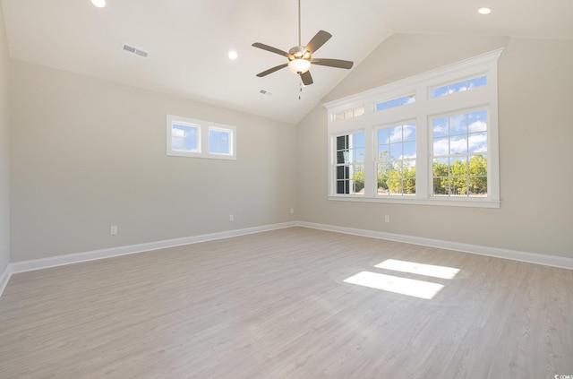 spare room featuring ceiling fan, light hardwood / wood-style flooring, and high vaulted ceiling