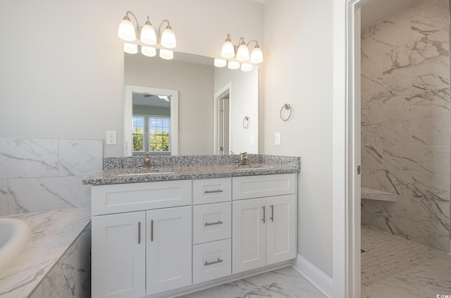 bathroom with a chandelier, shower with separate bathtub, and vanity