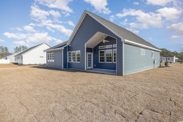 back of property with a patio