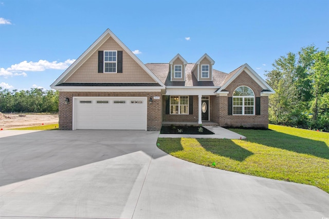 view of front of home featuring a garage and a front yard