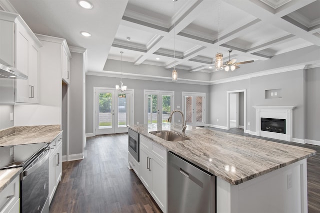 kitchen with sink, ceiling fan with notable chandelier, stainless steel appliances, dark hardwood / wood-style flooring, and french doors