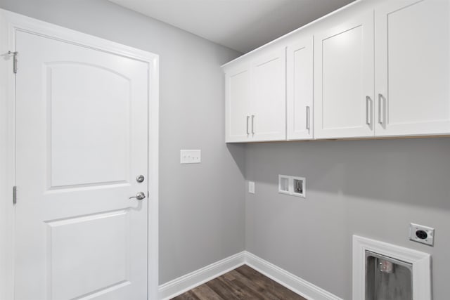 clothes washing area featuring washer hookup, dark wood-type flooring, electric dryer hookup, and cabinets