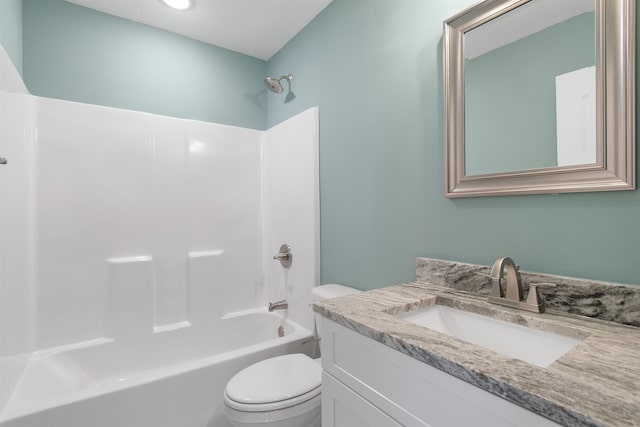 full bathroom featuring bathing tub / shower combination, vanity, and toilet