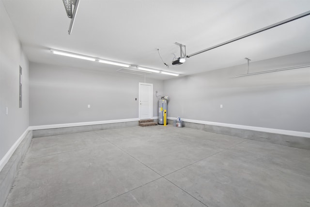 garage with a garage door opener and electric water heater