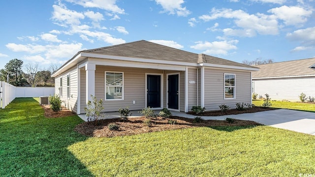 view of front of home with a porch, central AC, a front yard, and fence