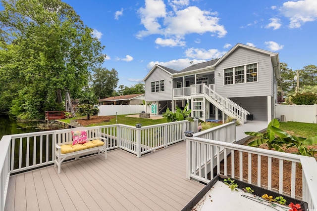 wooden deck featuring central AC unit