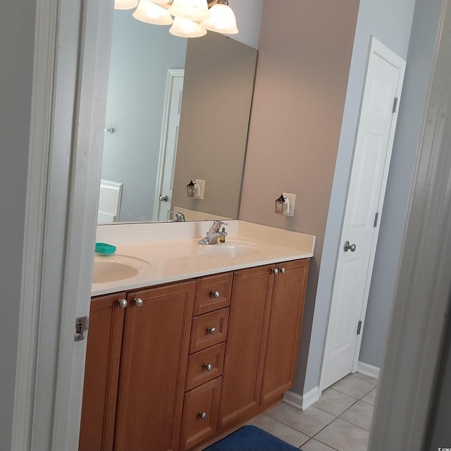 bathroom featuring tile floors, large vanity, and double sink